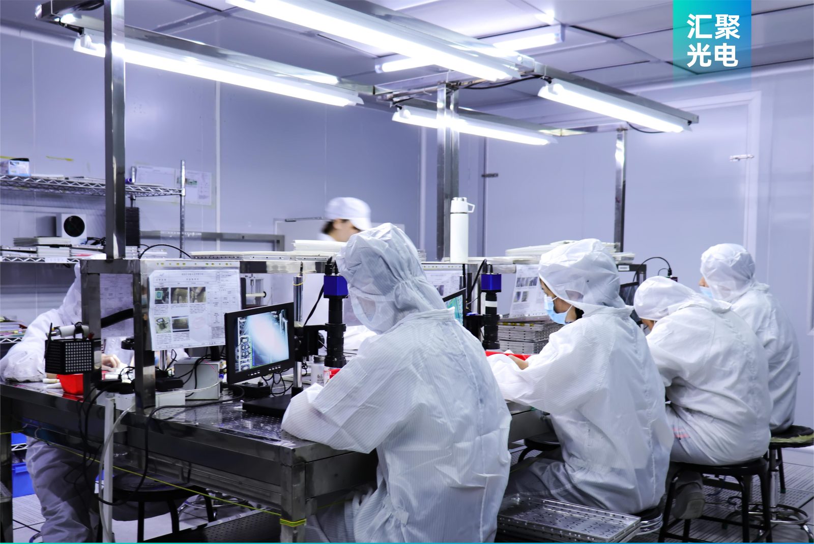 Clean room assembly with workers in particle-controlled environment